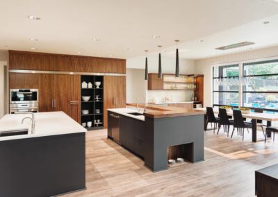 a kitchen with a dining table and chairs