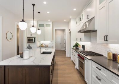 a kitchen with white cabinets and white counter tops